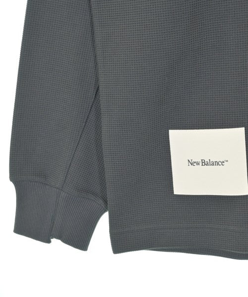 New Balance เสื้อยืด/เสื้อท็อปส์