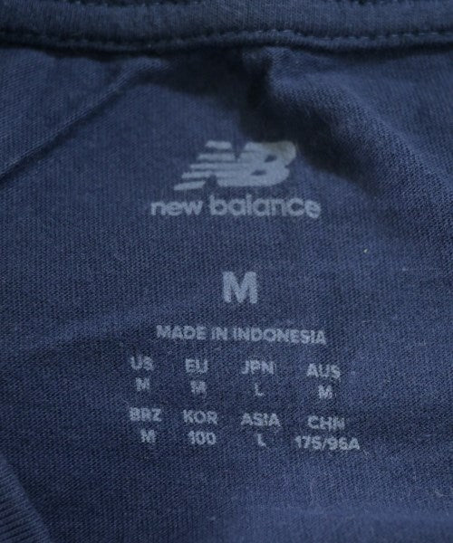 New Balance เสื้อยืด/เสื้อท็อปส์