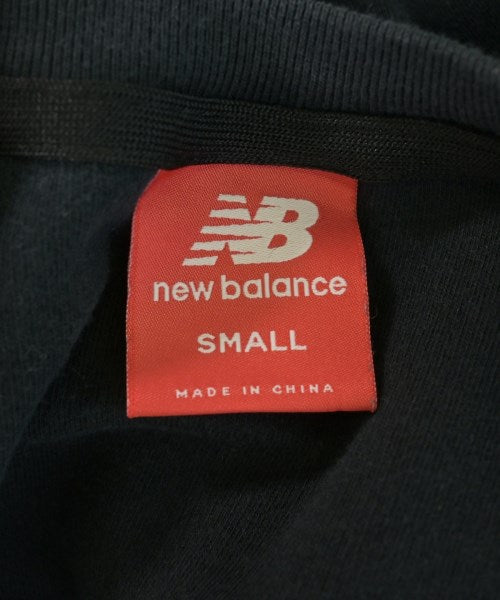 New Balance เสื้อยืด/เสื้อท็อปส์