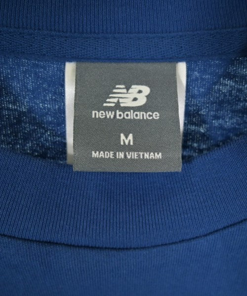 New Balance เสื้อยืด/เสื้อท็อปส์