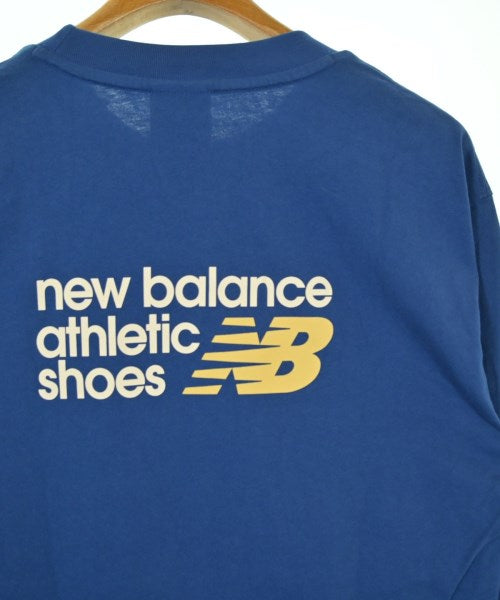 New Balance เสื้อยืด/เสื้อท็อปส์
