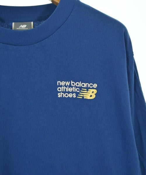New Balance เสื้อยืด/เสื้อท็อปส์