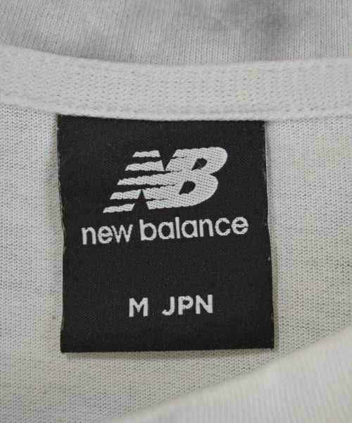 New Balance เสื้อยืด/เสื้อท็อปส์