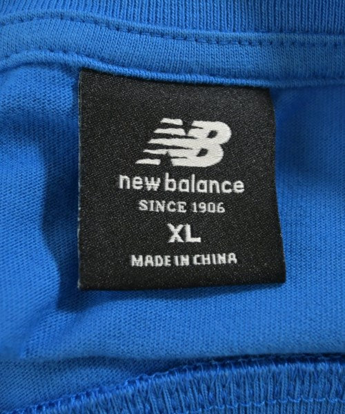 New Balance เสื้อยืด/เสื้อท็อปส์