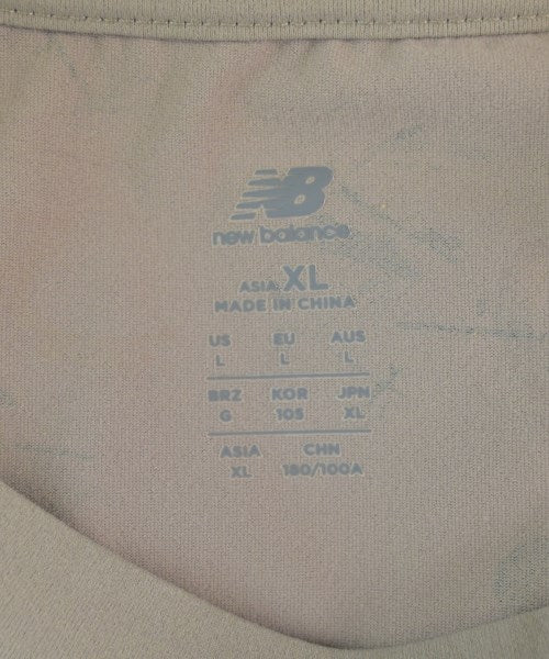 New Balance เสื้อยืด/เสื้อท็อปส์
