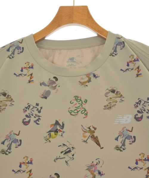 New Balance เสื้อยืด/เสื้อท็อปส์