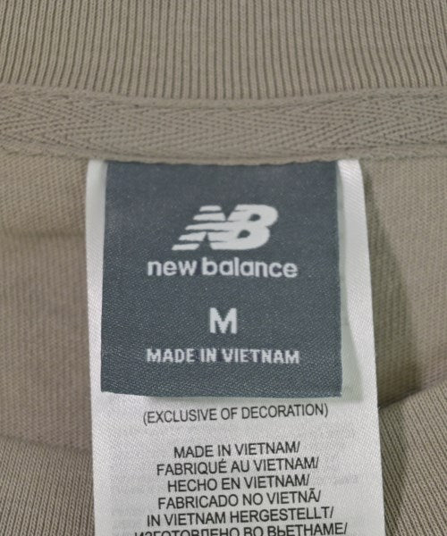 New Balance เสื้อยืด/เสื้อท็อปส์