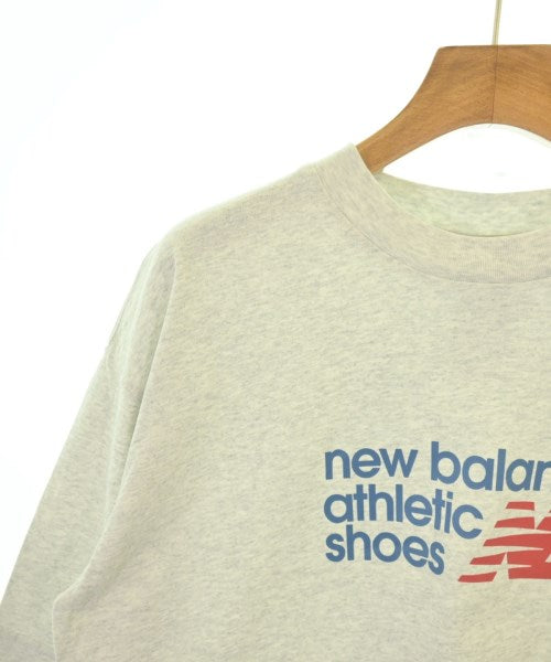 New Balance เสื้อยืด/เสื้อท็อปส์