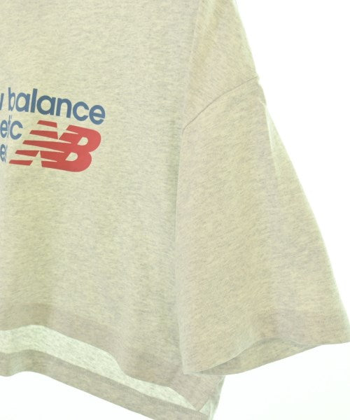 New Balance เสื้อยืด/เสื้อท็อปส์