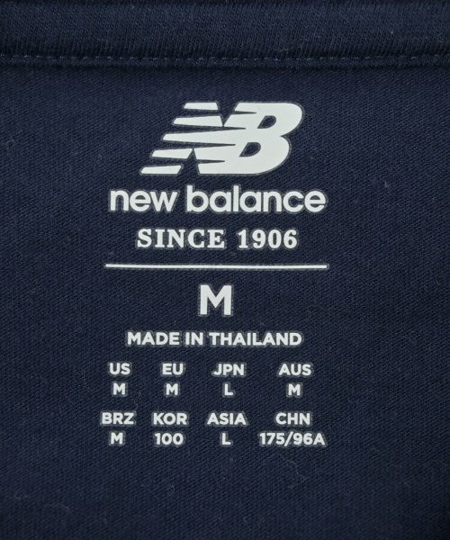 New Balance เสื้อยืด/เสื้อท็อปส์