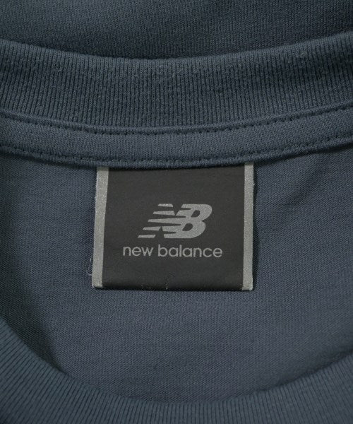 New Balance เสื้อยืด/เสื้อท็อปส์