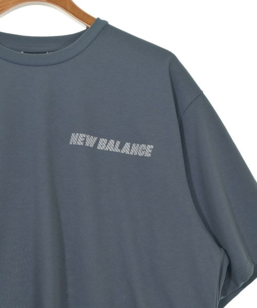New Balance เสื้อยืด/เสื้อท็อปส์