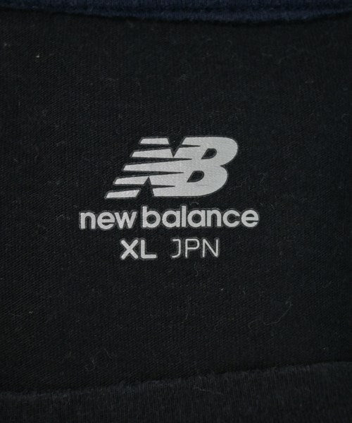 New Balance เสื้อยืด/เสื้อท็อปส์