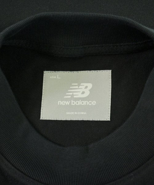 New Balance เสื้อยืด/เสื้อท็อปส์