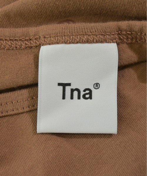 TNA เสื้อยืด/เสื้อท็อปส์