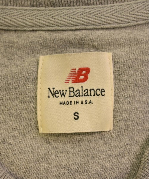 New Balance เสื้อยืด/เสื้อท็อปส์