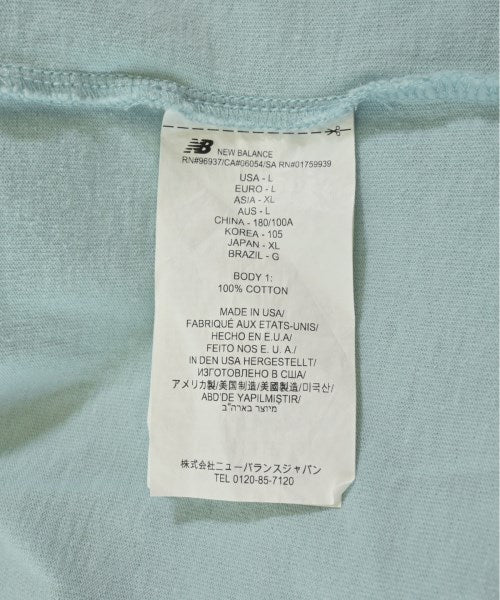 New Balance เสื้อยืด/เสื้อท็อปส์