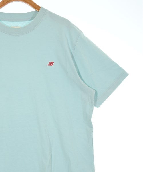 New Balance เสื้อยืด/เสื้อท็อปส์