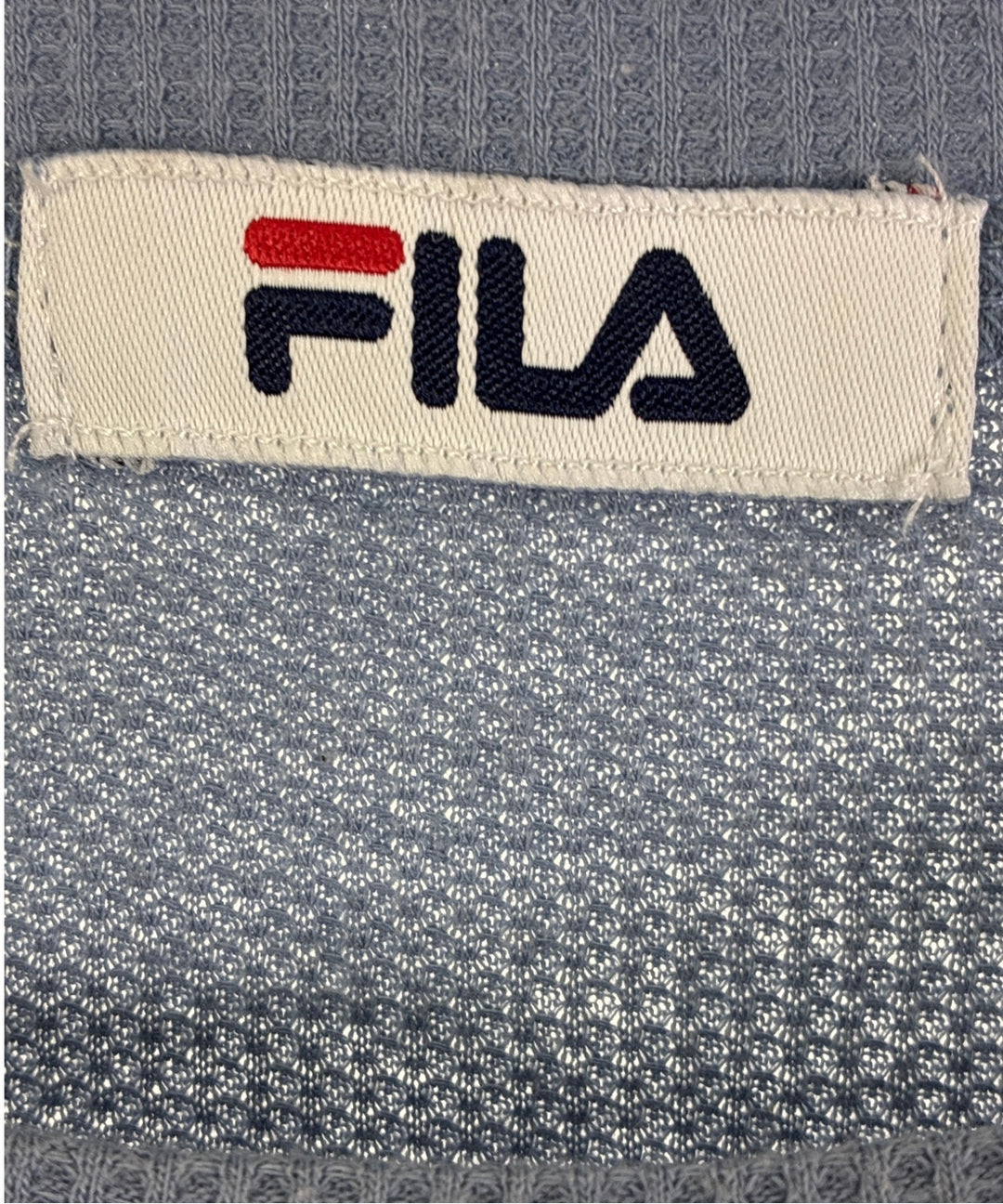 FILA เสื้อยืด/เสื้อท็อปส์