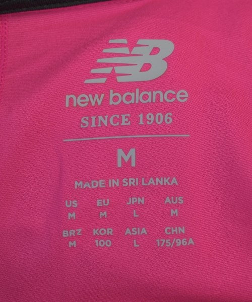 New Balance เสื้อยืด/เสื้อท็อปส์
